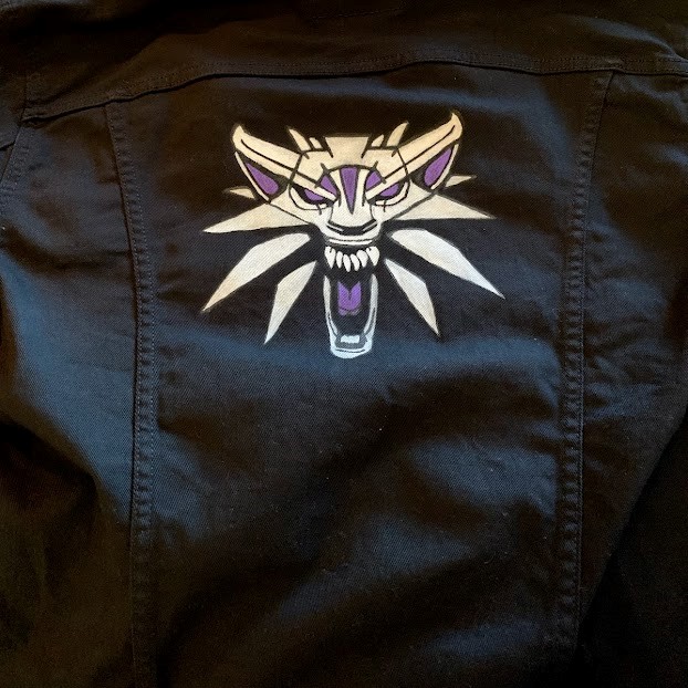 denim jacket with witcher logo painted